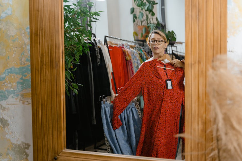 Woman trying on swimsuit in dressing room mirror - swimsuit shopping mistakes to avoid