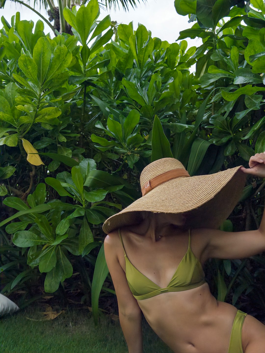 Beach accessories - bikini paired with wide-brimmed sun hat for spring break style