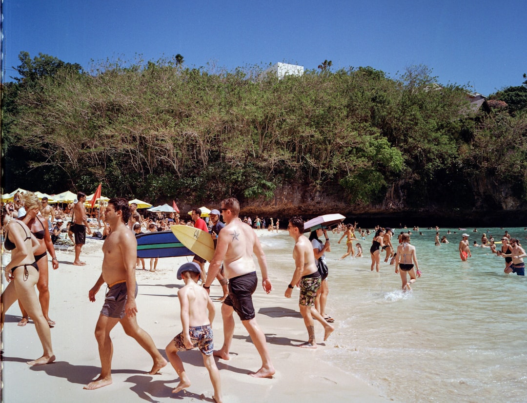 Group of people enjoying beach activities showcasing body positivity
