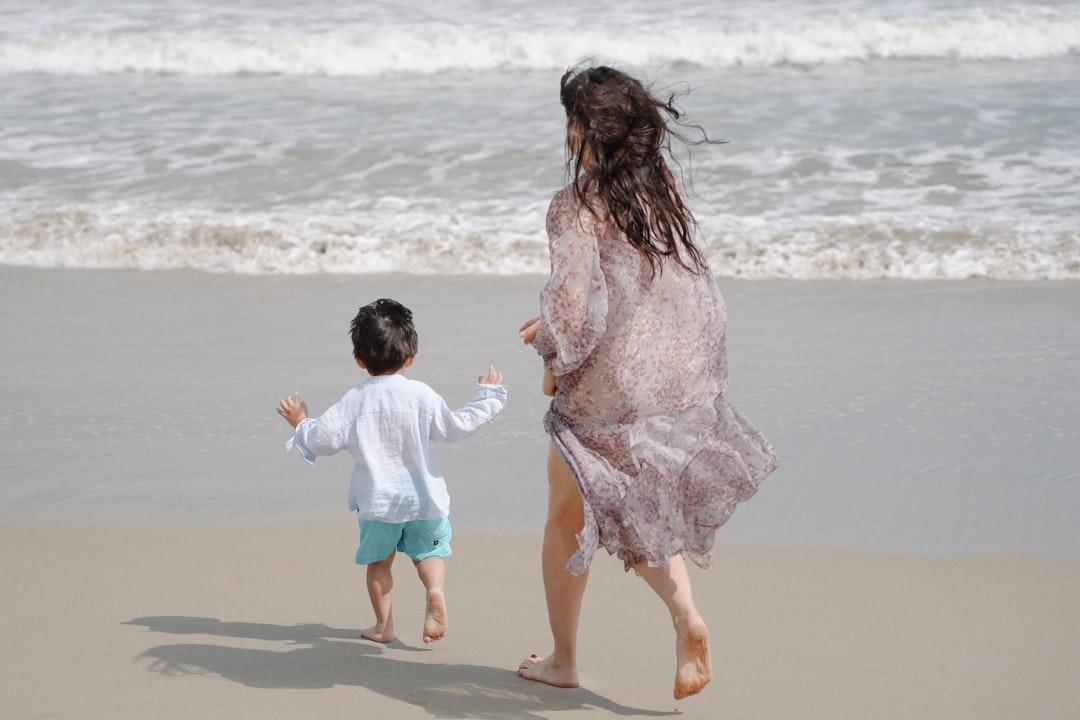 Woman running towards sea with confidence and joy embracing body positive lifestyle