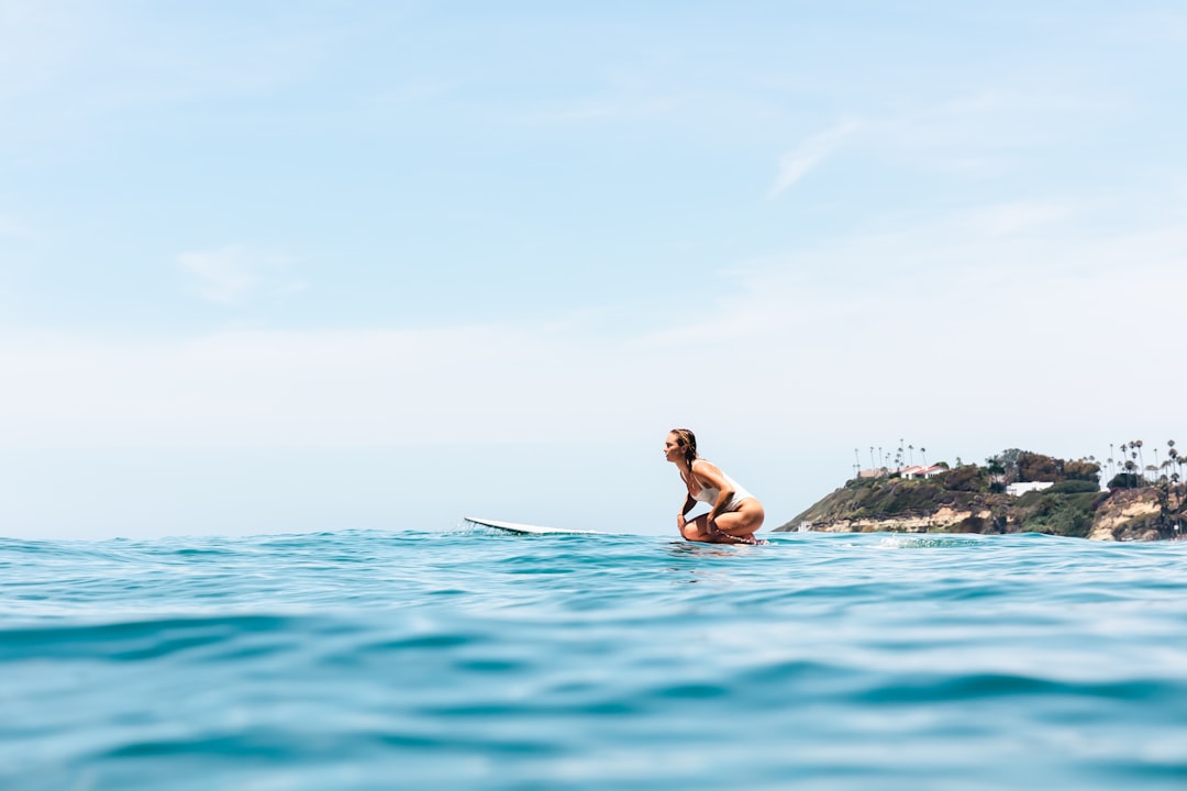 a man on a surfboard in the ocean