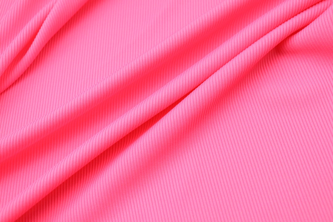 Lycra swimsuit fabric close-up showing stretch and weave