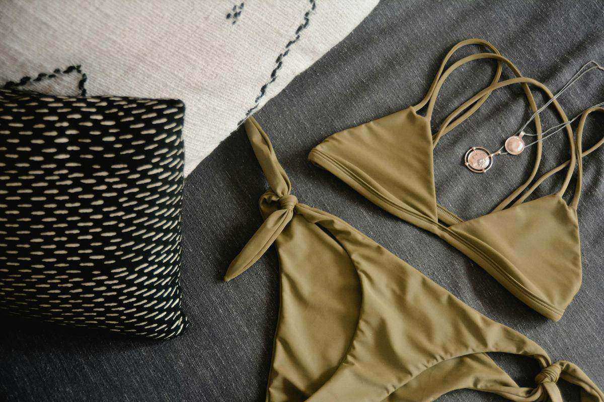 3 piece bikini set on beach with matching cover up