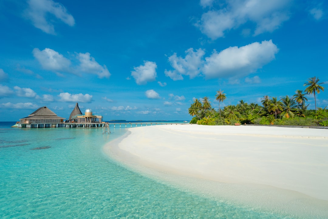 The white sandy beach near the spa at Anantara Kihavah Maldives Villas in Baa Atoll, Maldives.