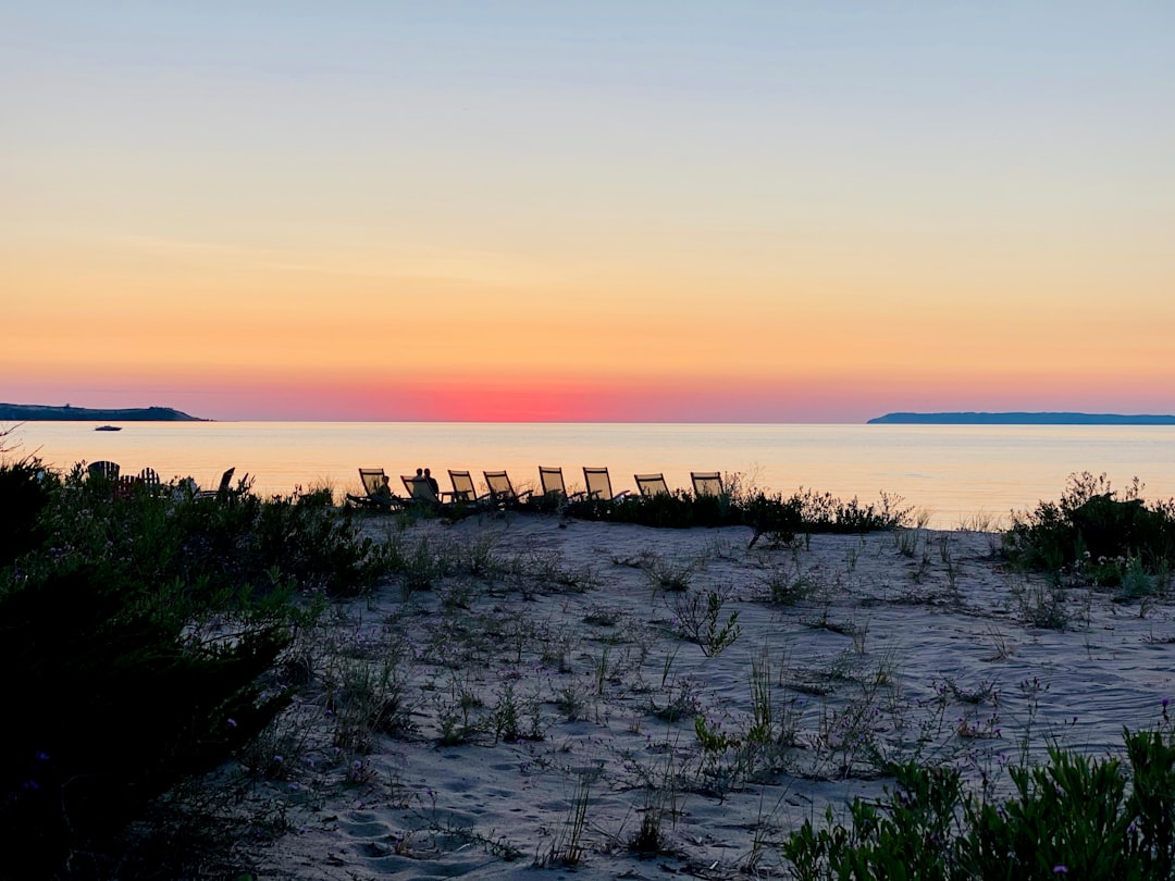 Beach chairs at sunset on Lake Michigan