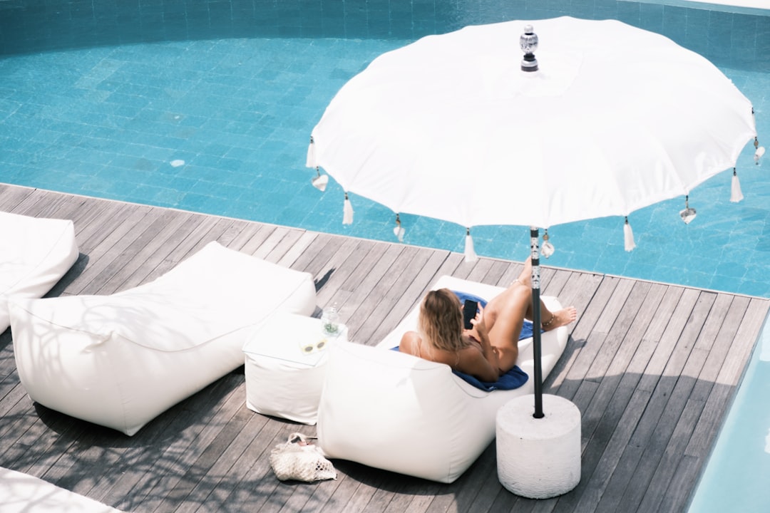 A woman relaxing poolside