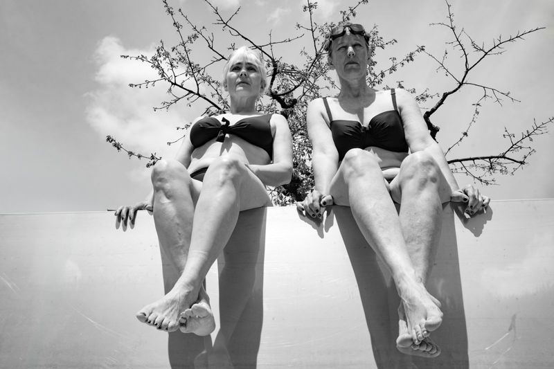 Women of all ages wearing high waisted bikinis