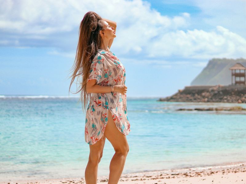 Print kaftan bikini cover up worn on a tropical beach