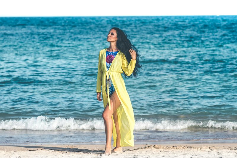 Yellow maxi bikini cover up dress at the beach