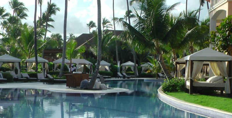 Tropical resort pool — vacation setting for apple shape swimwear style