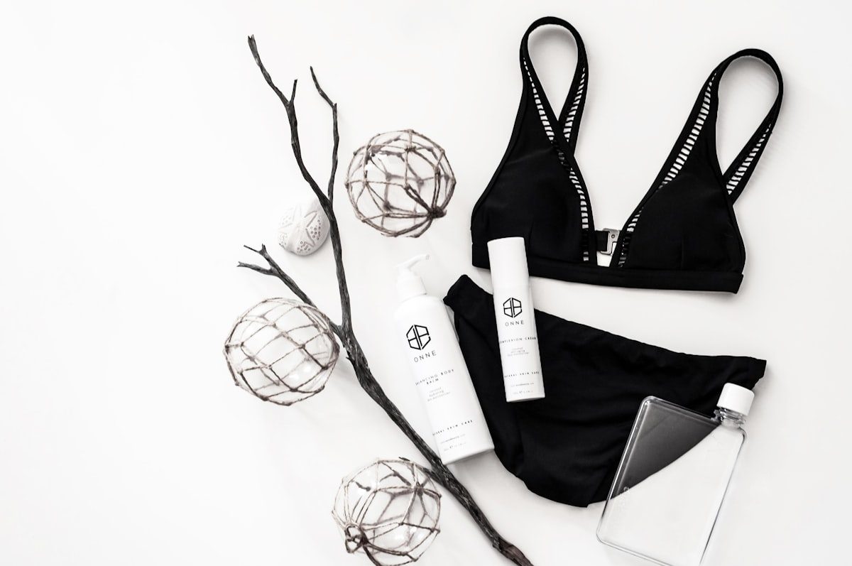 Best bikini for small bust 2026 flat lay with black triangle bikini top