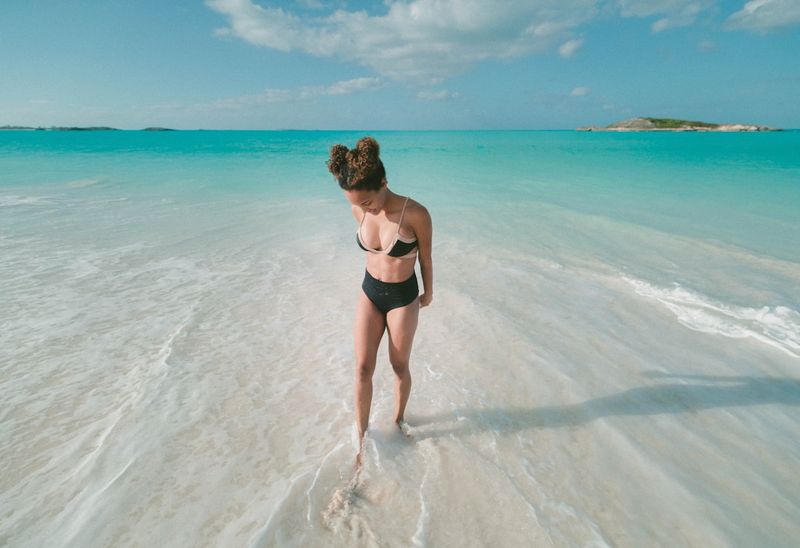 Supportive bikini top for large bust on white sand beach