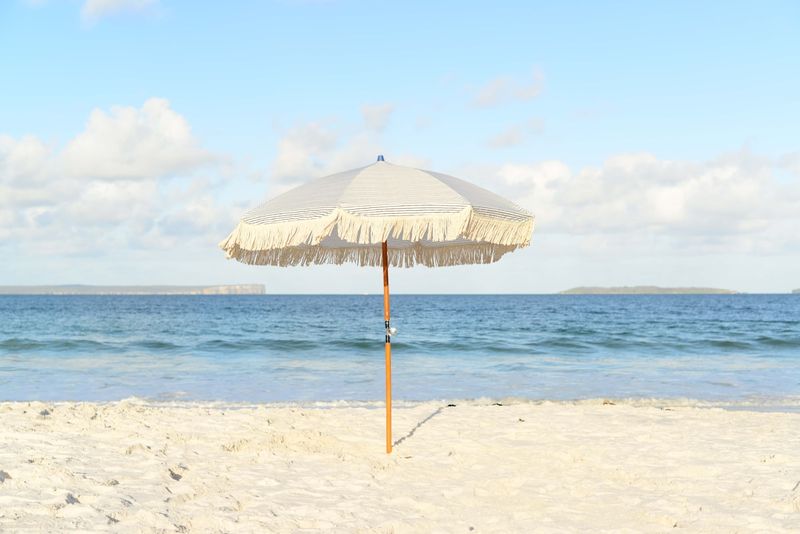 UV protection for swimwear under a beach umbrella on a sunny shore