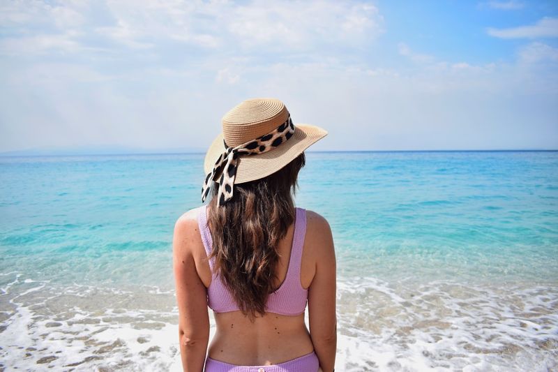 Full coverage bikini with sun hat modest beach style 2026