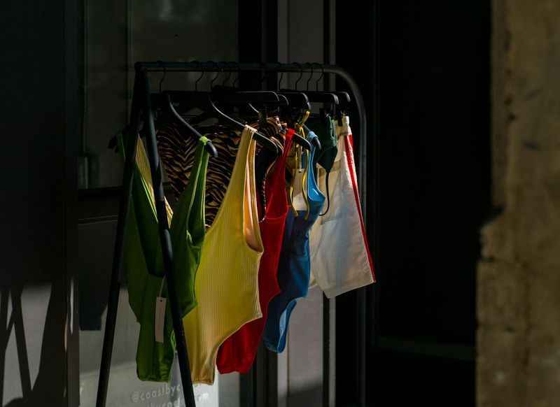 Colorful swimsuits hung to dry away from direct sun