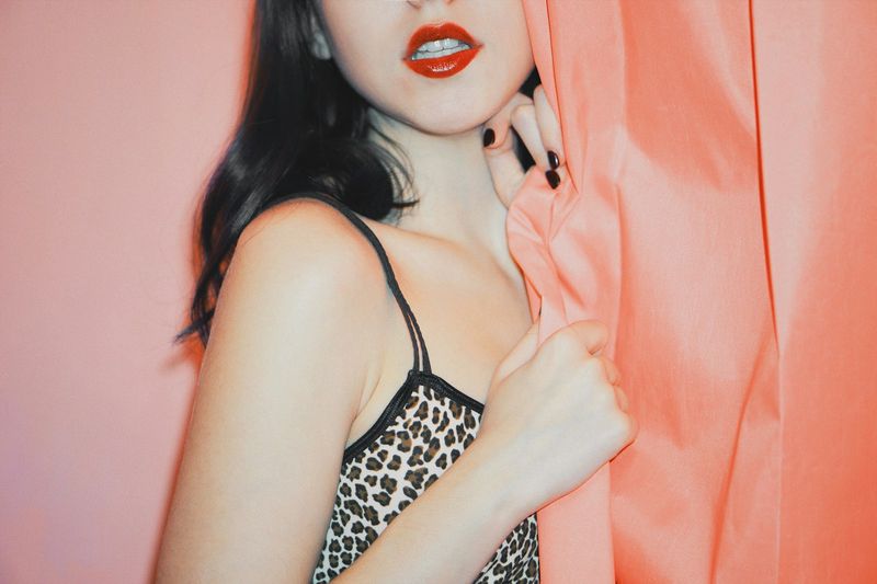 Woman wearing leopard print top styling the animal print swimwear trend