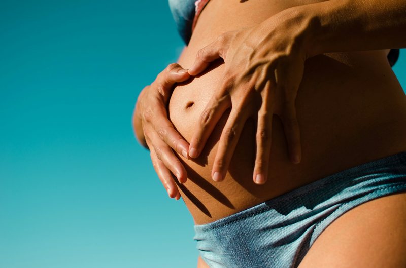Maternity bikini bottoms with over-the-bump coverage in the sun