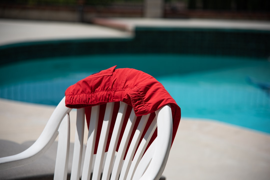 Red swim shorts drying by the pool 
