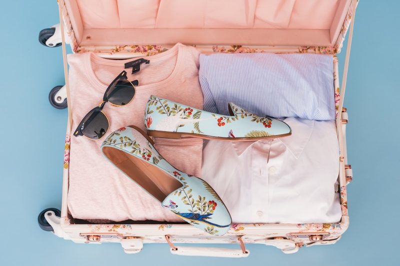 Packing swimwear in a suitcase for vacation