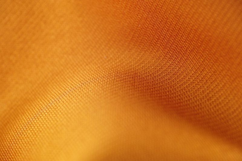 Close-up of swimwear fabric texture showing knit and lining construction