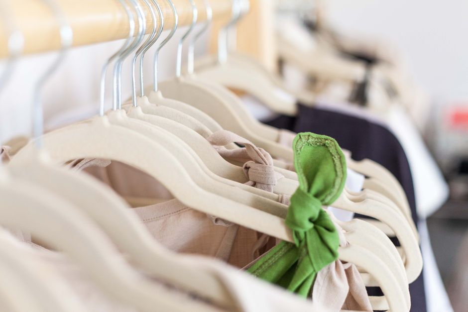A close-up view of fashion garments on hangers showcasing a variety of styles.