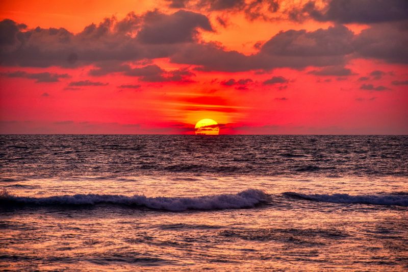 warm sunset tones matching swimsuit colors for warm skin tones