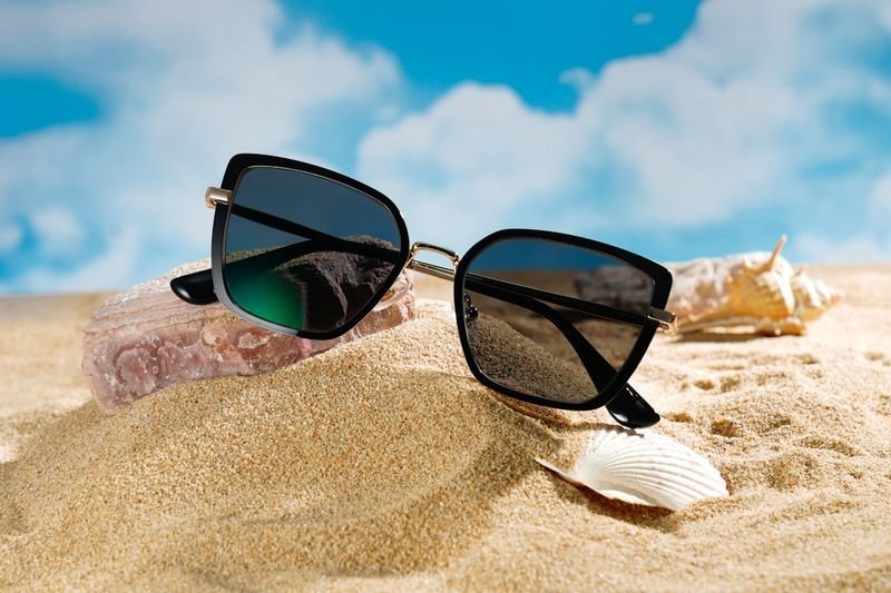 sunglasses on sand beach vacation accessories