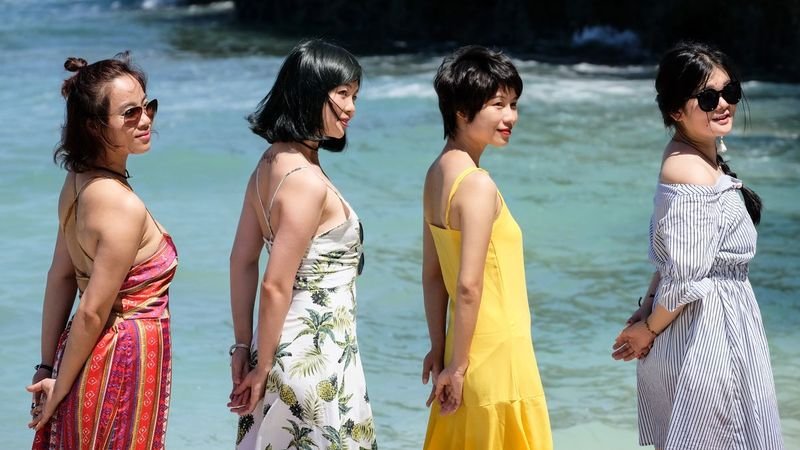 group of women at beach in summer fashion swimwear outfits Bali 2026
