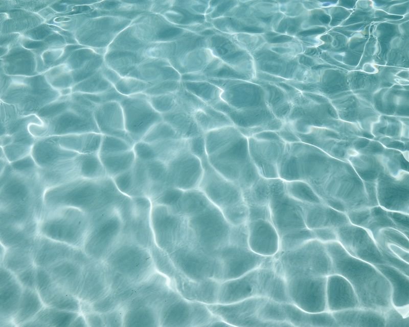 Close-up of chlorinated pool water that causes skin exposure and dryness