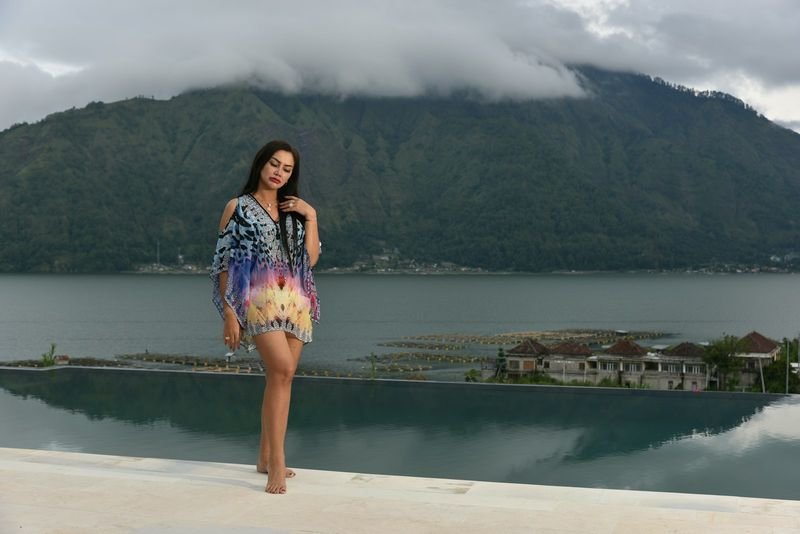 fit-and-flare swim dress on a woman by the water