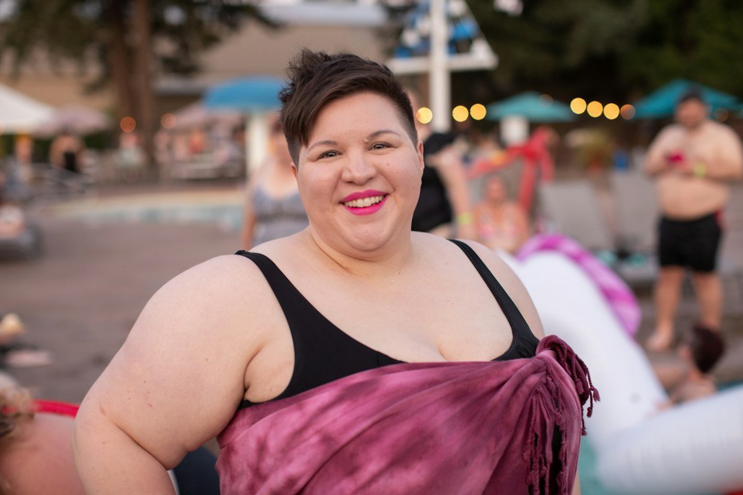 Plus size woman at a pool party