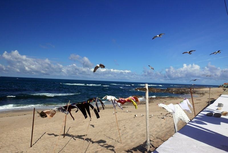 Quick-dry swimwear fabric drying on a travel clothesline