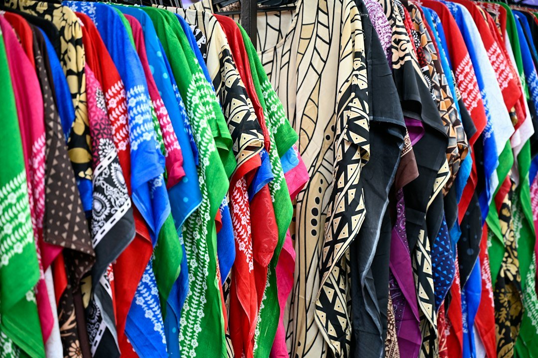 Colorful patterned scarves hanging on a rack