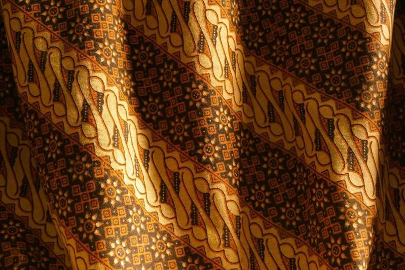 Close-up of colorful batik fabric pattern with traditional motifs