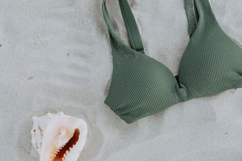 Bikini top flat lay representing swimwear subscription box contents
