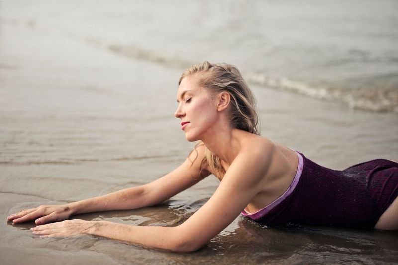 vintage swimwear woman posing at the beach