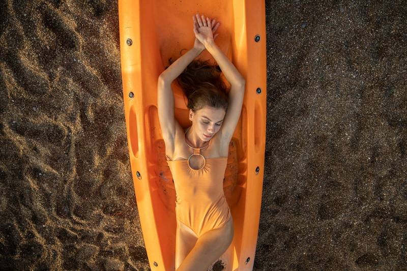 Wrap-style one piece swimsuit that cinches the waist for an hourglass shape