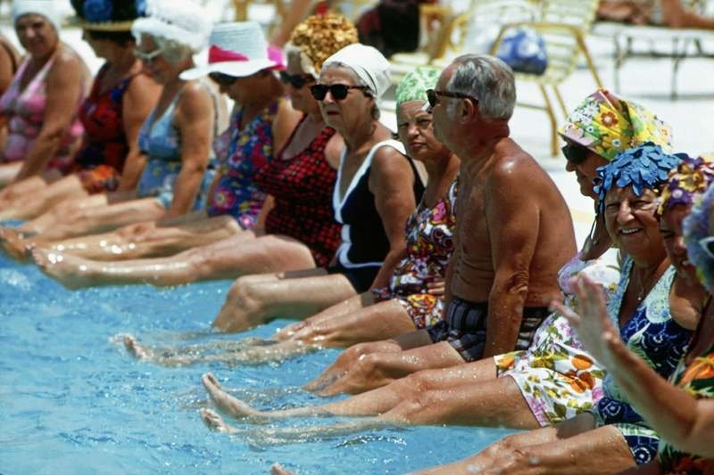 Aqua aerobics swimwear class seated pool exercise