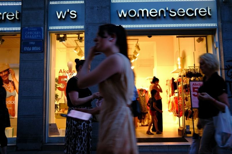 Woman shopping for mastectomy swimwear in a clothing store