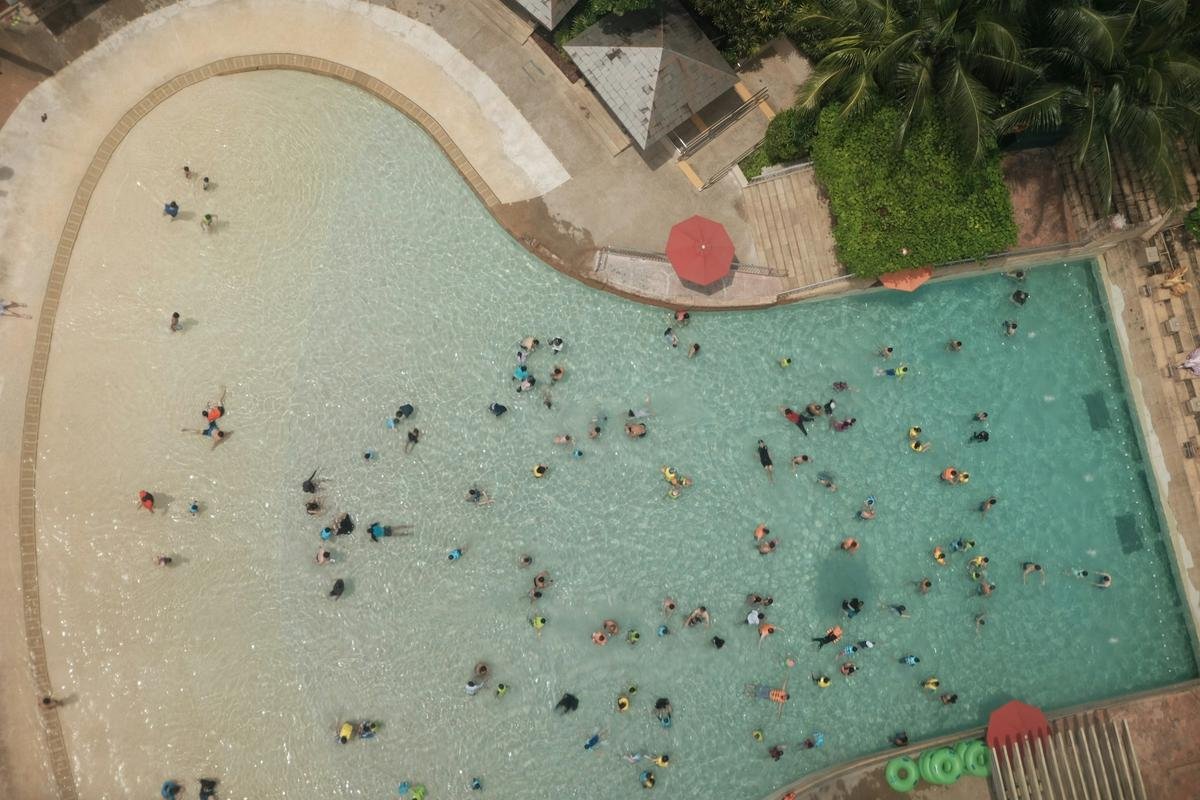 Crowded public pool showing public pool etiquette in a busy shared space