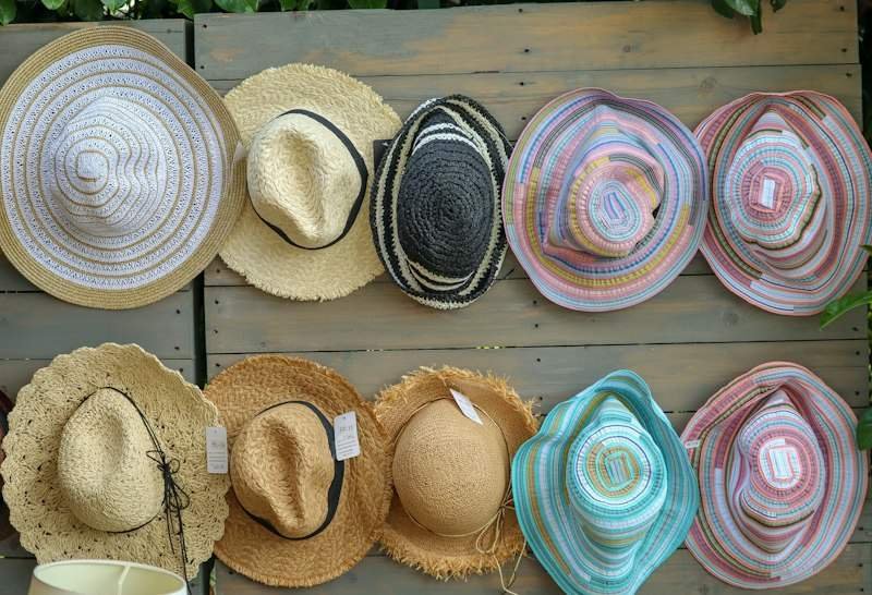 Collection of straw sun hats in different styles and colors