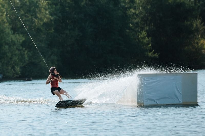 Wakeboarding swimwear staying secure through a hard water splash landing